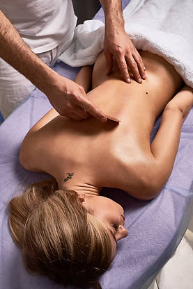 Gua sha treatment on a women's back.