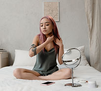 Woman using facial gua sha.